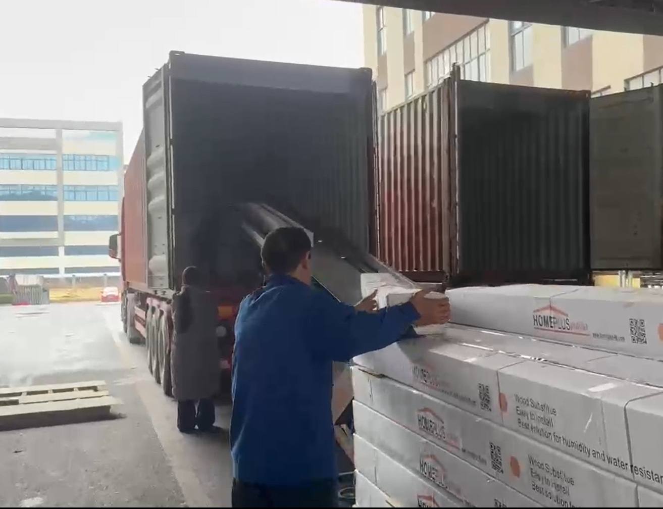 Home Plus products being loaded into an export container